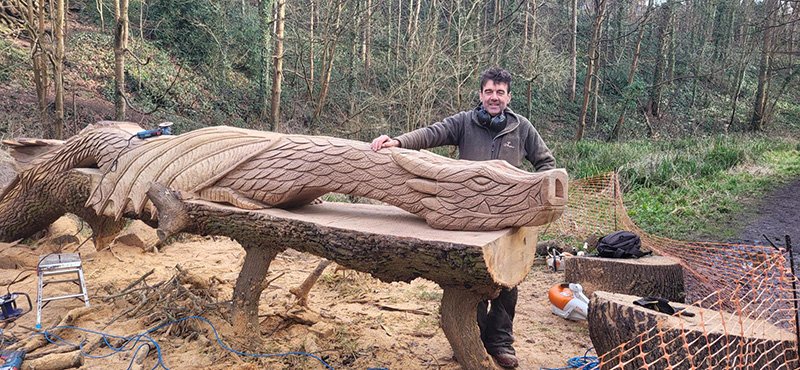 Andy poses with his dragon sculpture