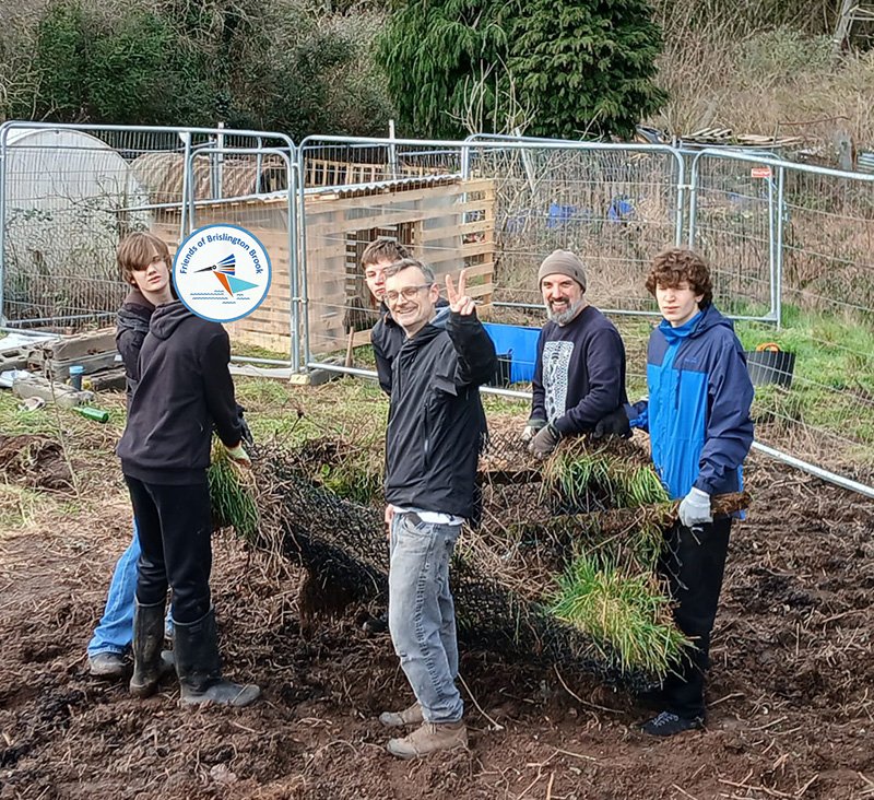 DOE volunteers and James putting up the goat fencing